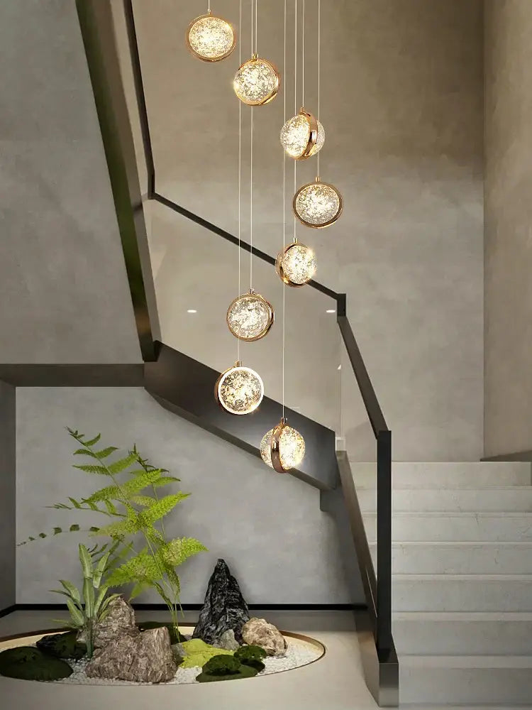 Luxury golden decorbites crystal ball led rotating stair chandelier with spherical pendant lights and intricate crystal detailing