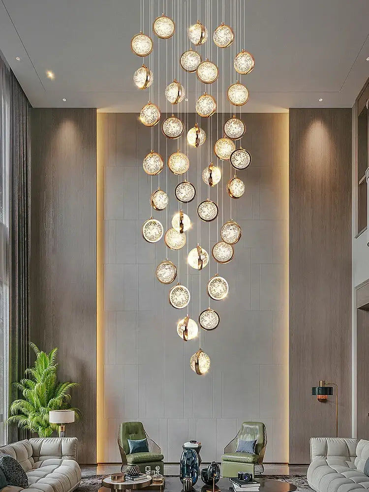 A luxury golden decorbites crystal ball led rotating stair chandelier with spherical glass orbs in gold frames