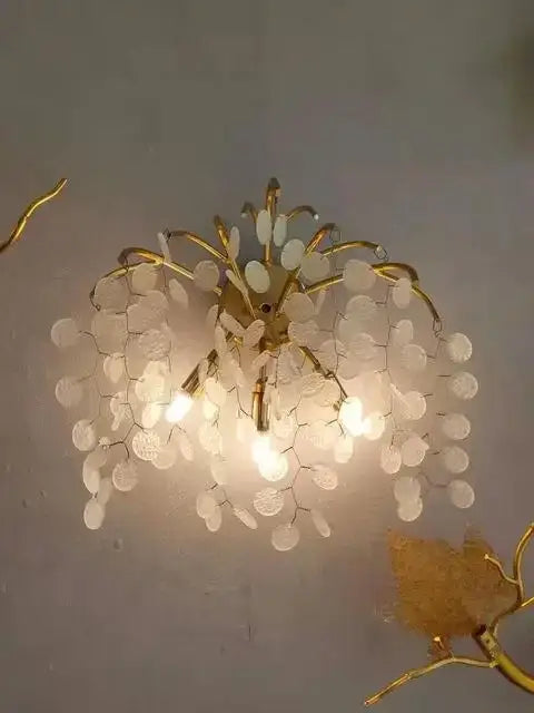 Luxury golden grapes crystal chandelier with gold-toned frame and translucent white glass discs for living room decorbites grapes crystal design