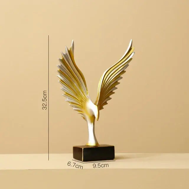 A sleek gold and silver eagle figurine with outstretched wings on a black base for decorbites golden leopard living room decor