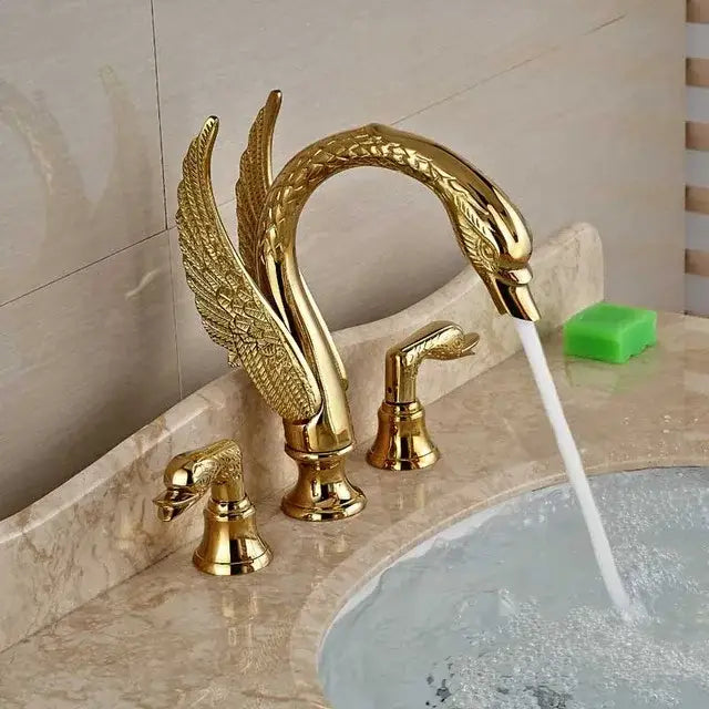 Luxury golden swan dual handle bathroom faucet with polished metallic finish and intricate feather detail by decorbites golden swan