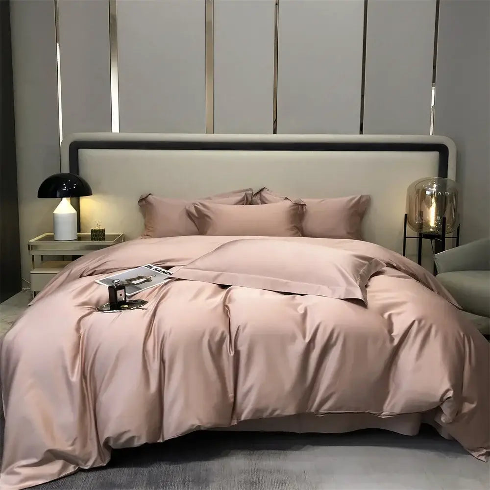 Luxury blush pink satin duvet set with matching pillowcases featuring smooth glossy finish in egyptian cotton bedding set