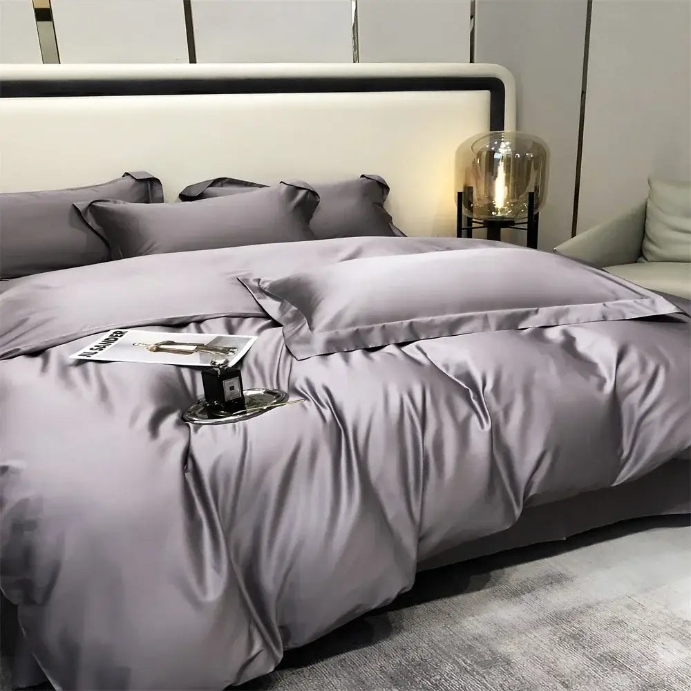 Luxurious gray satin egyptian cotton bedding set with matching pillows elegantly arranged on a modern bed