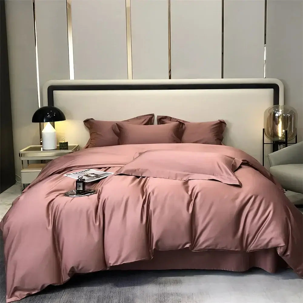 A plush rose gold satin duvet set with matching pillowcases featuring luxurious draping in a luxury gray egyptian cotton bedding set