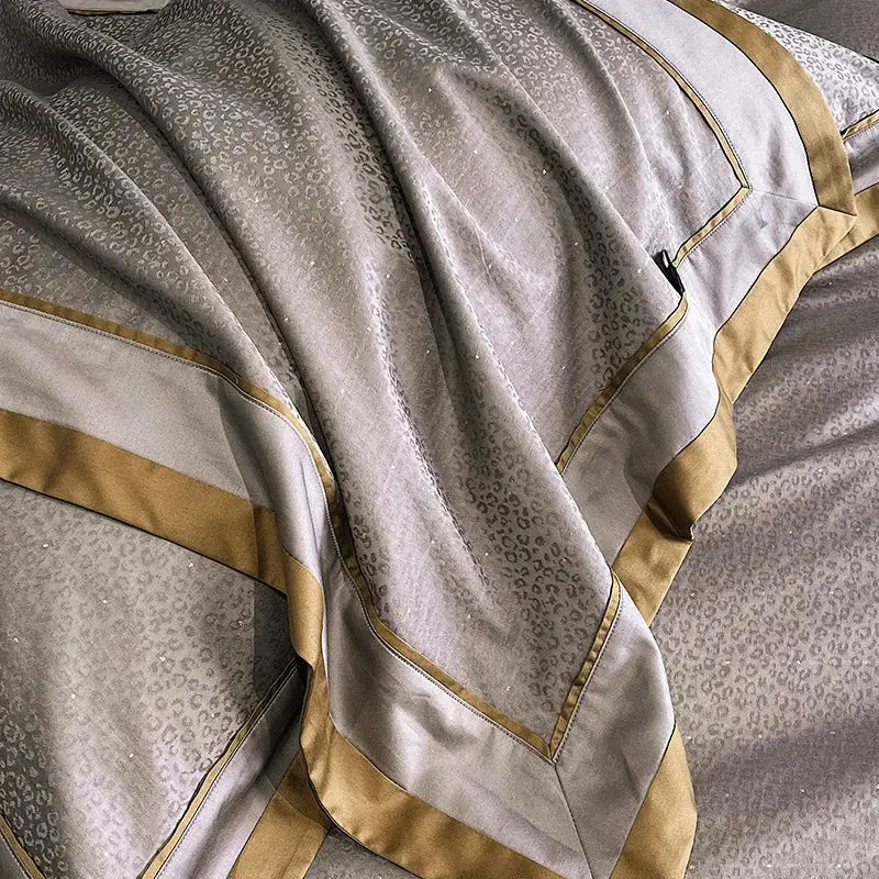 Luxurious silver-gray satin pillowcase with subtle cotton leopard jacquard pattern and gold trim from egyptian cotton leopard bedding set