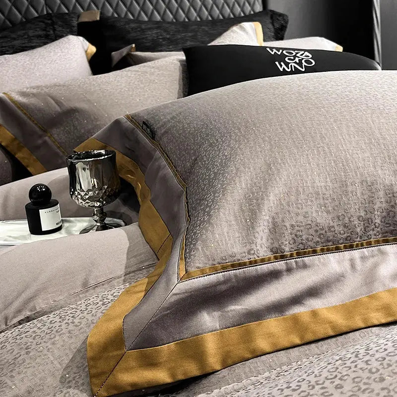 Luxury gray satin pillowcase with gold trim and subtle cotton leopard jacquard pattern from bedding set