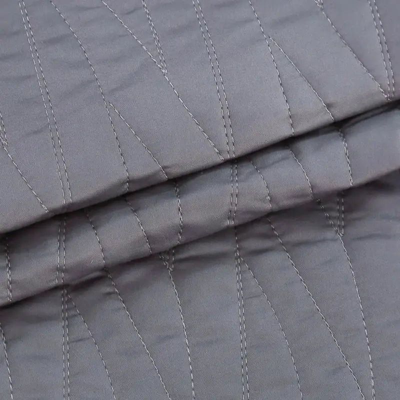 Luxury gray textured egyptian cotton quilt set with subtle diagonal stitching in lighter gray thread for bedroom bedding