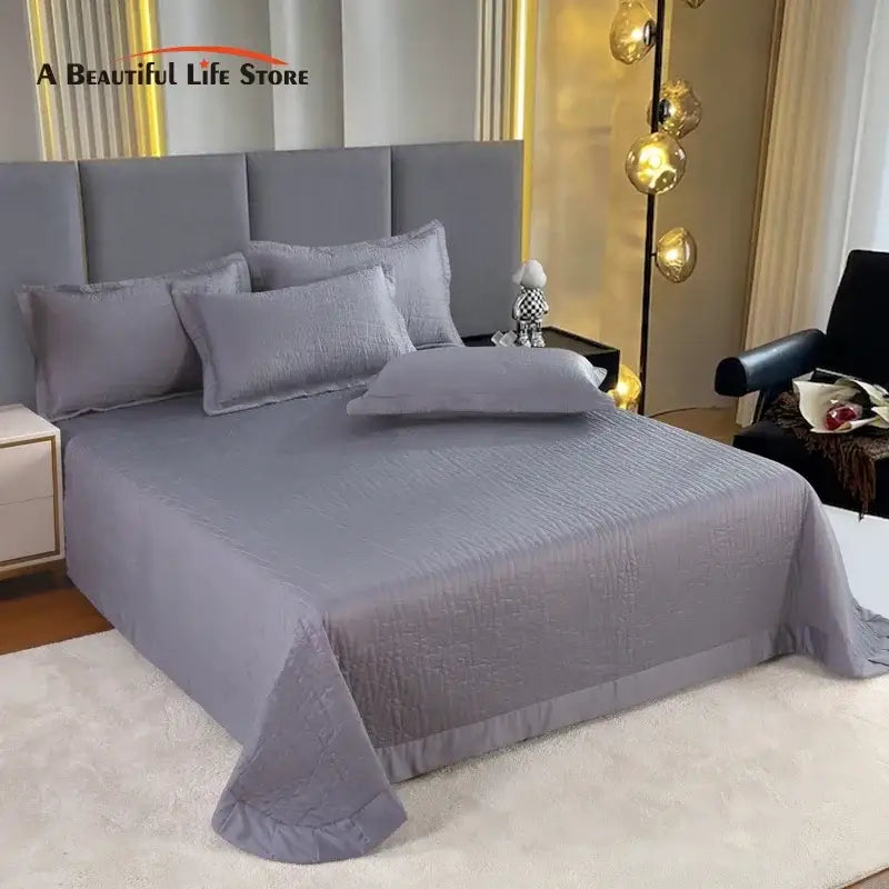 Luxury gray textured egyptian cotton quilt set featuring a subtle crinkled finish with matching pillows for bedroom bedding