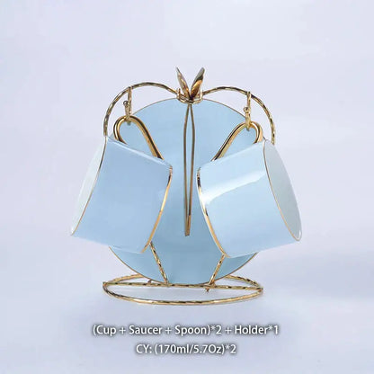 Luxury light blue bone china coffee set with gold rims displayed on a matching gold metal stand by decorbites bone china