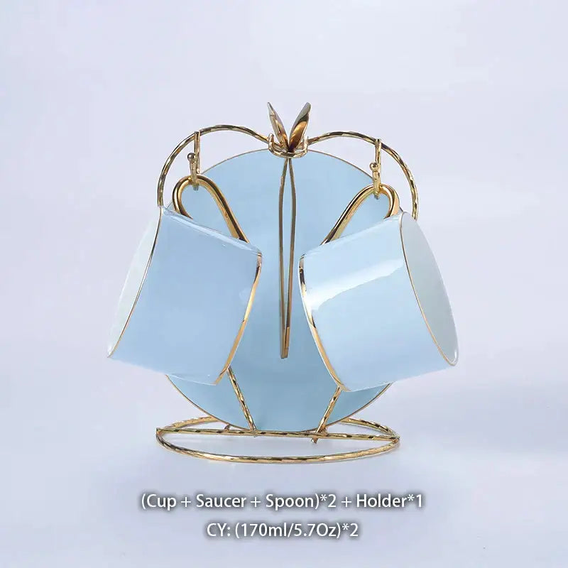 Luxury light blue bone china coffee set with gold rims displayed on a matching gold metal stand by decorbites bone china