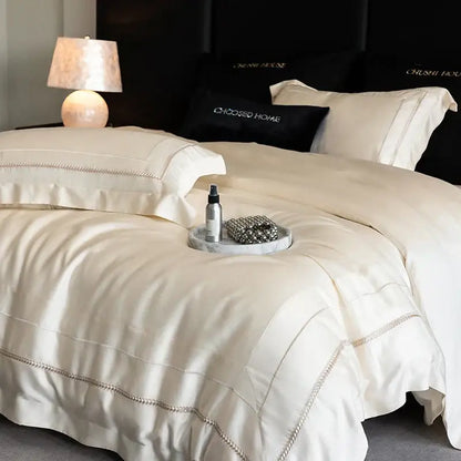 Luxury cream-colored satin bedding set with silver-threaded embroidery edges in decorbites light champagne luxury egyptian cotton