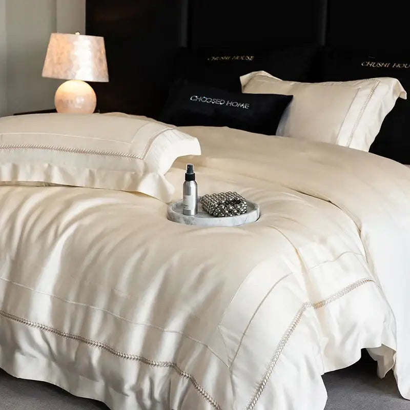 Luxury cream-colored satin bedding set with silver-threaded embroidery edges in decorbites light champagne luxury egyptian cotton