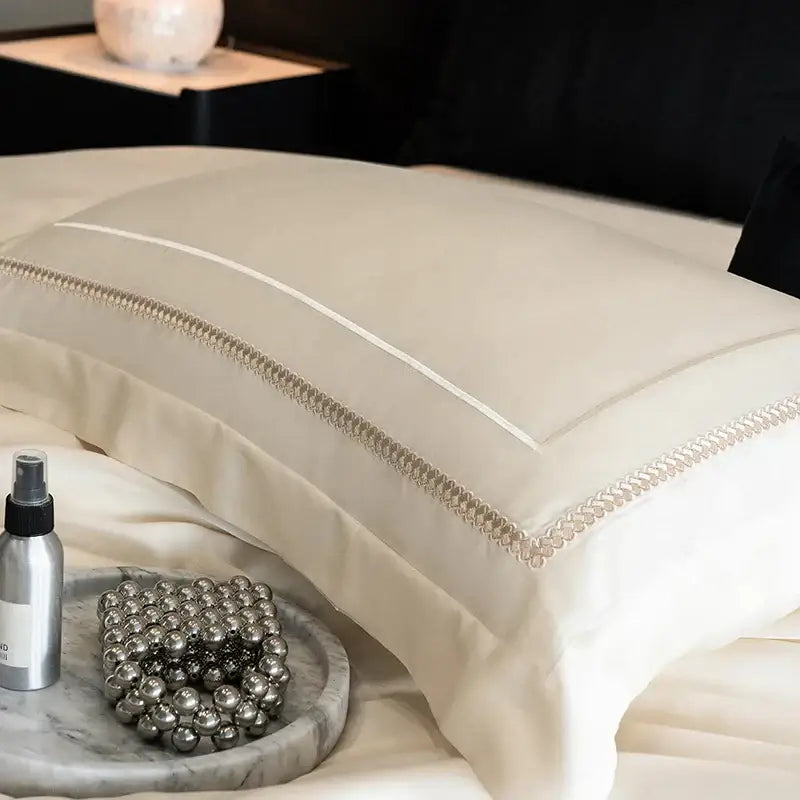 Cream-colored satin pillowcase with silver beaded trim in light champagne luxury bedding set egyptian cotton decorbites