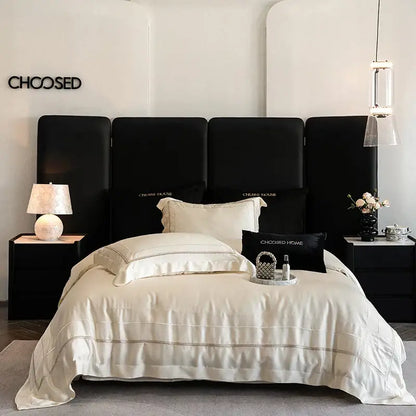 Luxury light champagne bedding set in cream-colored Egyptian cotton satin with subtle embroidery and matching pillows