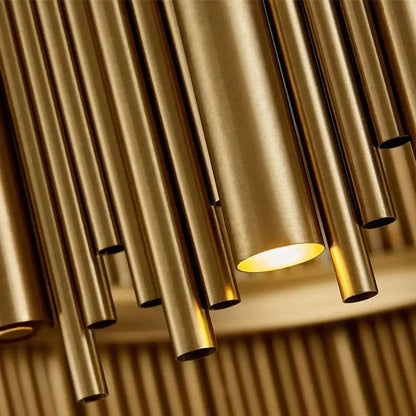 Modern brass tube pendant light with warm glowing illumination in luxury modern round gold chandelier for living room use