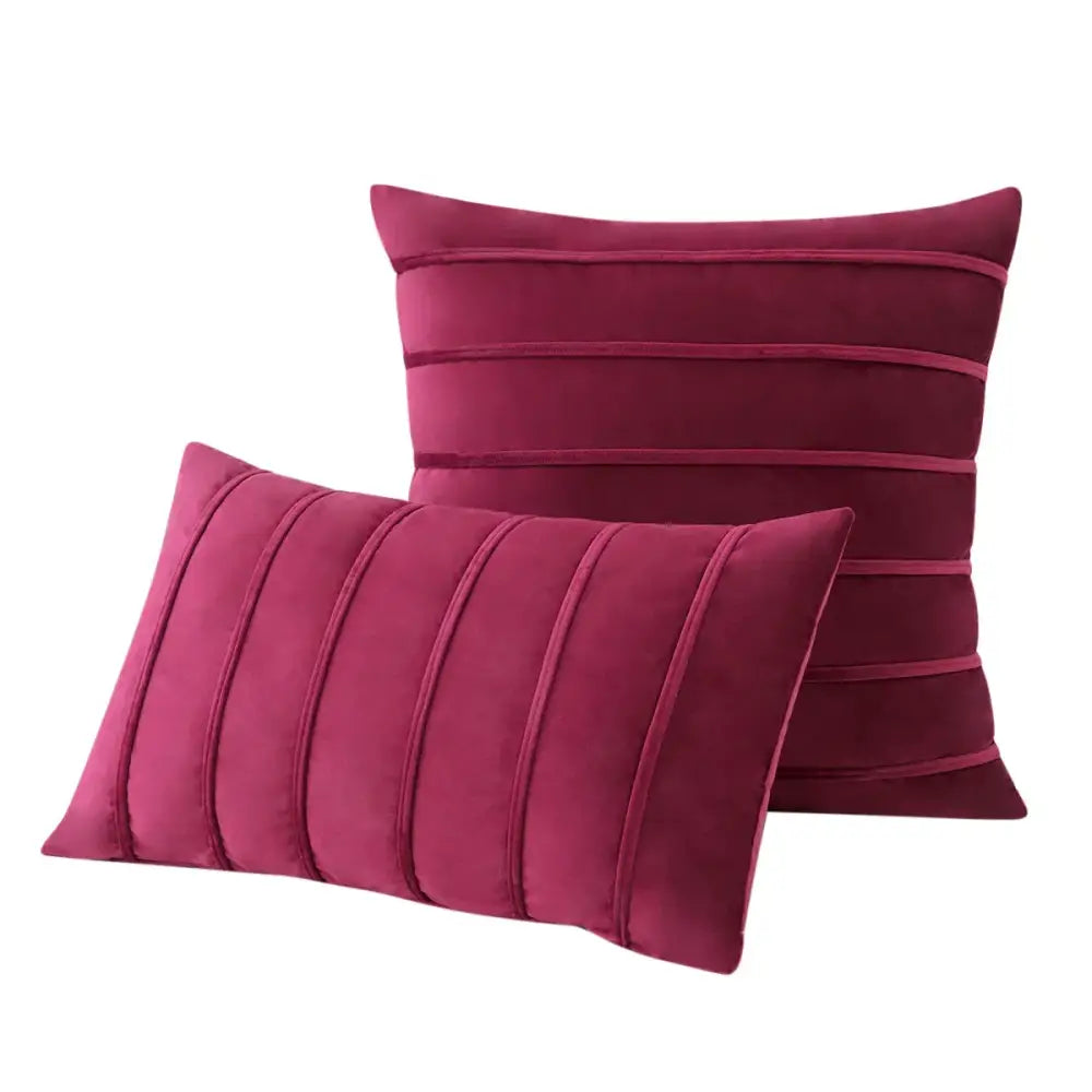 Two plush burgundy velvet throw pillows with stitched stripes complement decorbites blue velvet stripe pillow covers