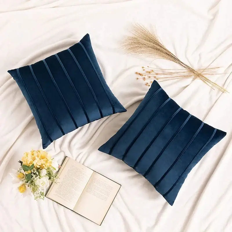 Two navy blue velvet throw pillows with vertical pleated detailing featured as decorbites blue velvet stripe pillow covers