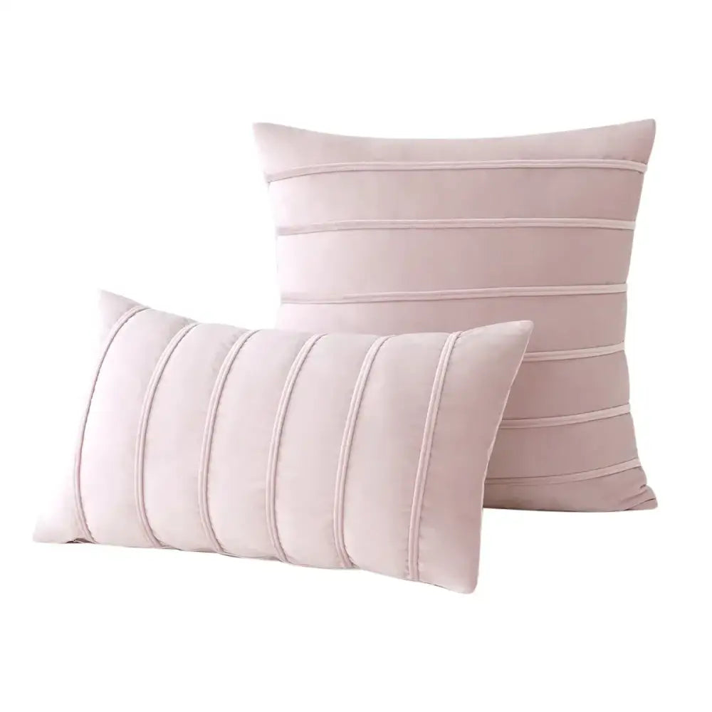 Pair of blush pink velvet pillow covers with subtle horizontal pleating complement decorbites blue velvet stripe cases