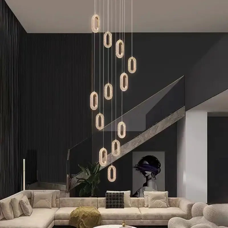 Modern gold-toned decorbites crystal rings chandelier with oval pendant design for luxury staircase lighting
