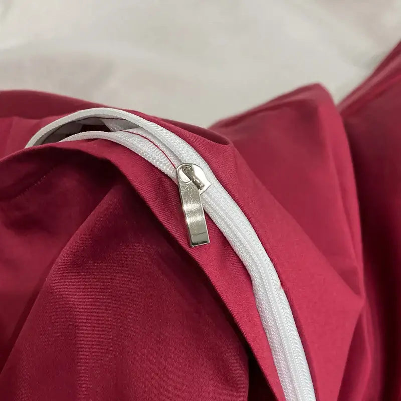 Luxury pink and cream egyptian cotton flower bedding set featuring a white zipper with a silver pull on red fabric