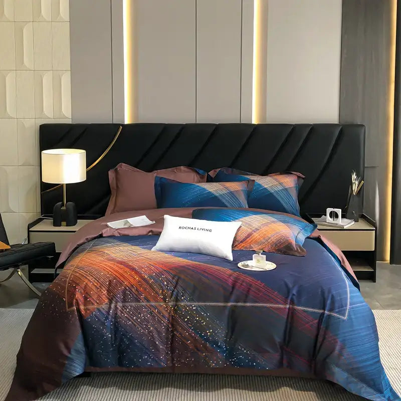 Luxury blue and orange cosmic-themed cotton flower bedding set with plaid pillows complementing a pink and cream bedroom