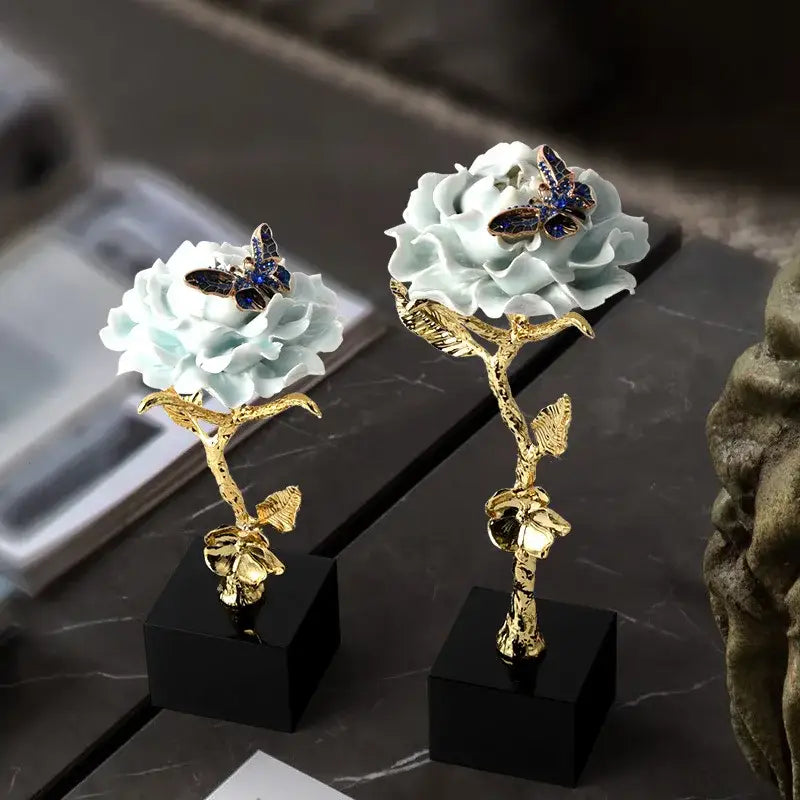 Elegant luxury porcelain crystal rose decor with gold stems and blue butterflies on black square bases for living room