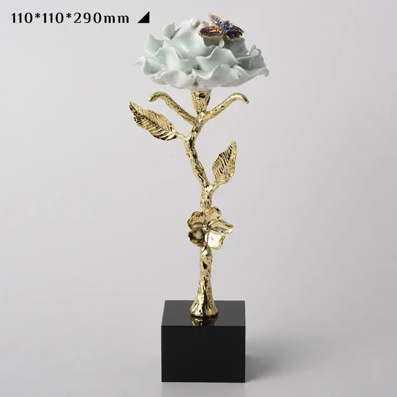 Luxury porcelain crystal rose decor with a golden stem and jeweled butterfly for blue and gold living room ornament