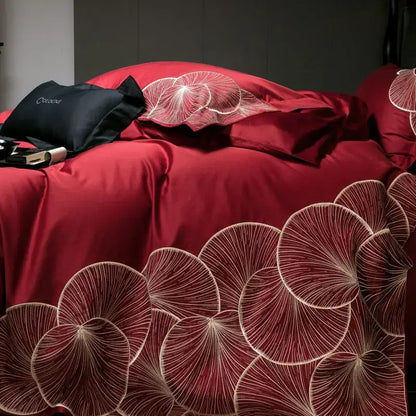 Luxury red and white lotus embroidered cotton bedding set featuring rich crimson satin duvet cover with elegant patterns