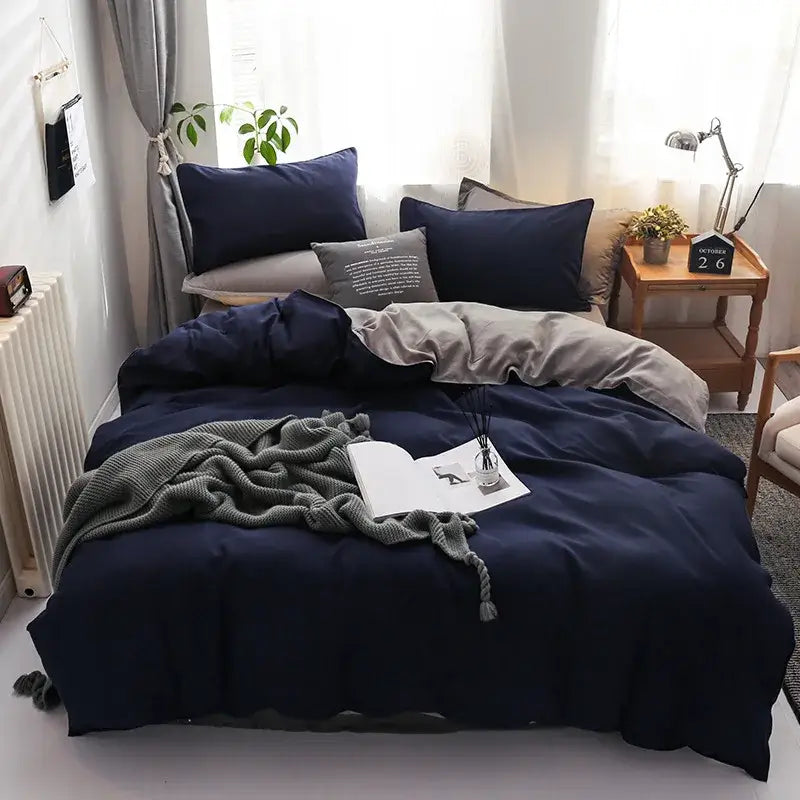 Luxury satin decorbites light gray and navy duvet cover set with matching pillows and gray throw blanket for bedroom bedding