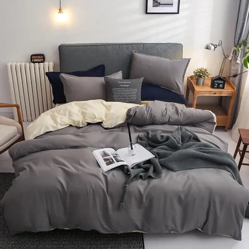 Luxury satin light gray and navy duvet cover set with smooth finish and coordinating pillows for bedroom decorbites duvet cover