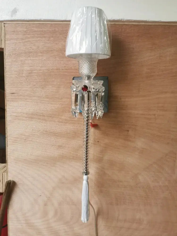 Luxury silver crystal wall lamp featuring a white pleated shade and decorbites crystal wall faceted glass elements