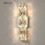 Luxury silver crystal deluxe wall sconce with faceted clear glass segments on a sleek metal plate for living room decorbites