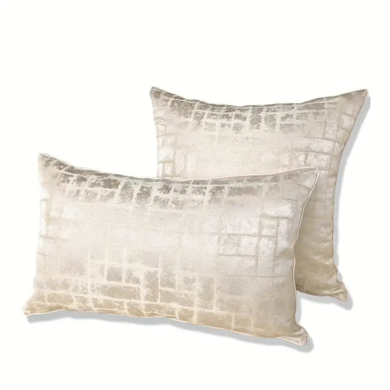Cream-colored luxury cushion cover with subtle metallic grid pattern made of silver quilted jacquard for bedroom use