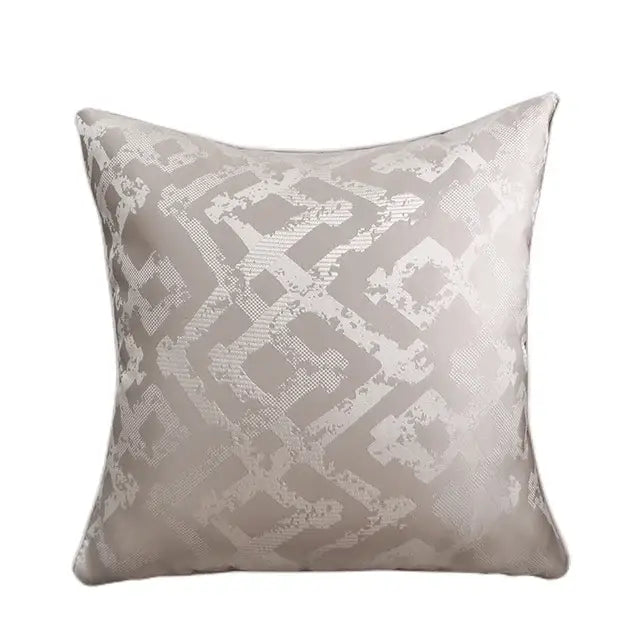A luxury cushion cover in light gray with subtle white and silver geometric quilted jacquard pattern for bedroom use