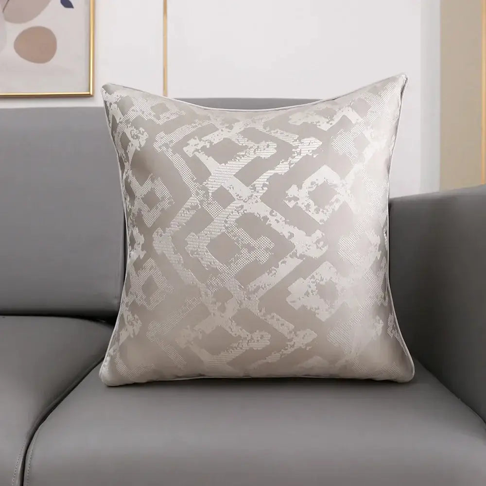 Luxury cushion cover in light gray with subtle white and silver geometric jacquard pattern for bedroom use