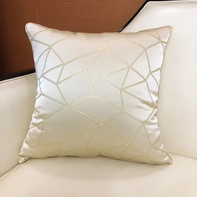 Luxury cushion cover in cream-colored satin with subtle geometric metallic embroidery for elegant bedroom decor