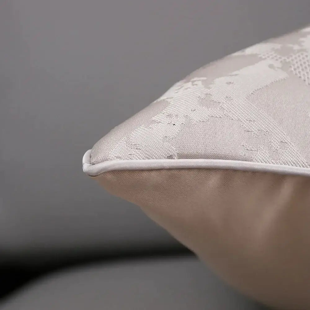 Luxury silver quilted jacquard cushion cover in off-white with subtle texture and white piping for bedroom decor