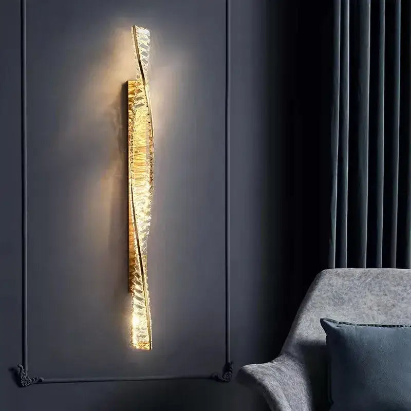 A luxury textured crystal gold wall lamp with a sleek glass body and curved design for elegant living room decorbites wall lamp