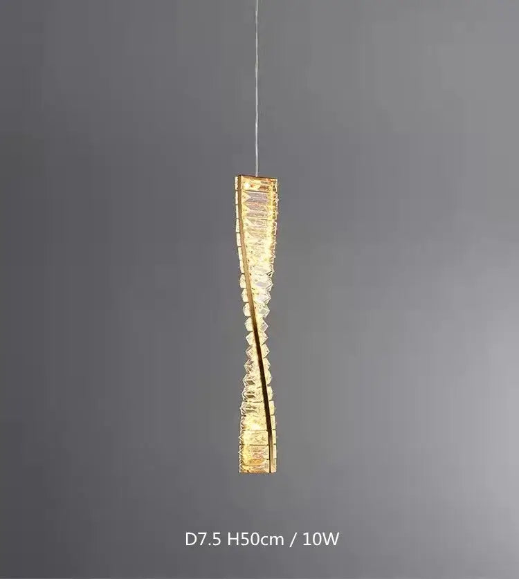 A sleek crystal gold wall lamp with twisted glass design and warm golden light for luxury living room decorbites