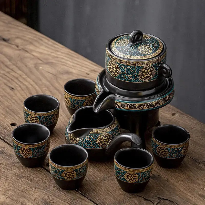 Black ceramic kung fu tea set with intricate turquoise and gold floral patterns for luxury dining room use