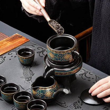 Black ceramic kung fu tea set with intricate turquoise and gold floral patterns for luxury dining room use