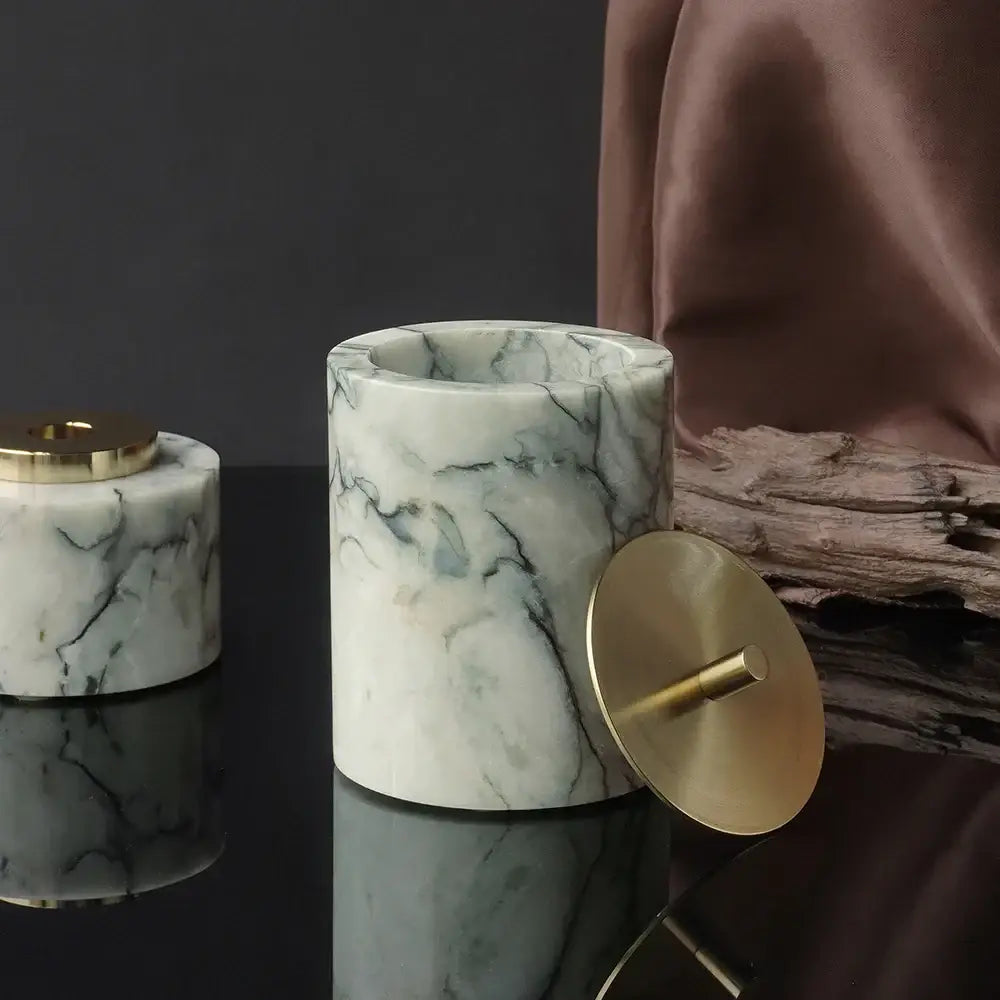 Luxury white marble ashtray with emerald veining and polished brass lid in an emerald marble bathroom set
