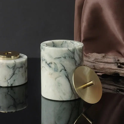 Luxury white marble ashtray with emerald veining and polished brass lid in an emerald marble bathroom set