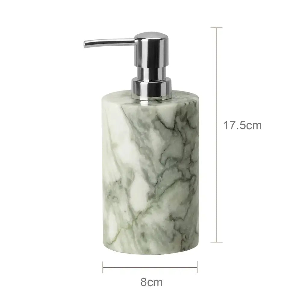A sleek cylindrical soap dispenser with a white and green marble body and chrome pump in an emerald marble bathroom set