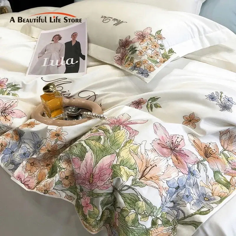Luxury white satin bedding set with delicate pink peach and blue cotton flowers embroidery in egyptian cotton material