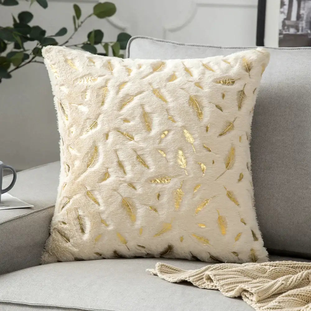 Luxury cream cushion cover with soft fuzzy texture and scattered golden leaf patterns perfect for decorbites golden fur decor