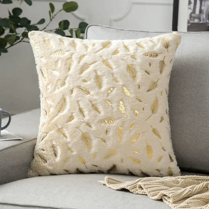 Luxury cream cushion cover with soft fuzzy texture and scattered golden leaf patterns perfect for decorbites golden fur decor