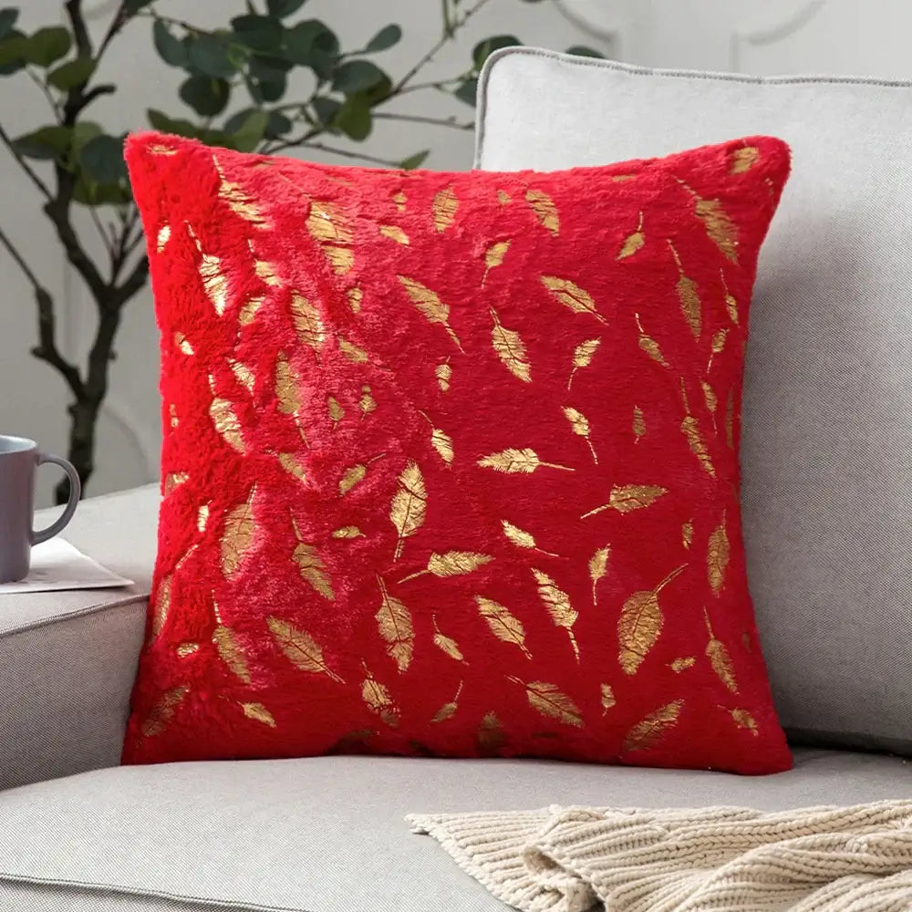 Red plush throw pillow with gold leaf embroidery complementing luxury white and gold decorbites golden fur cushion cover
