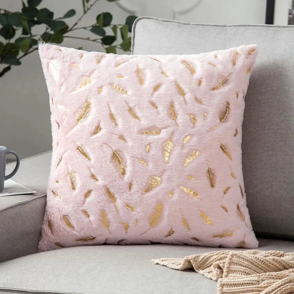 A soft pink plush luxury cushion cover with gold feather patterns for decorbites golden fur bedroom decor