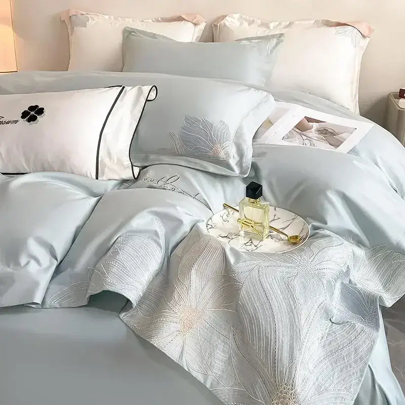 Luxury white and silver embroidered cotton bedding set with light blue satin and decorbites embroidered cotton detail